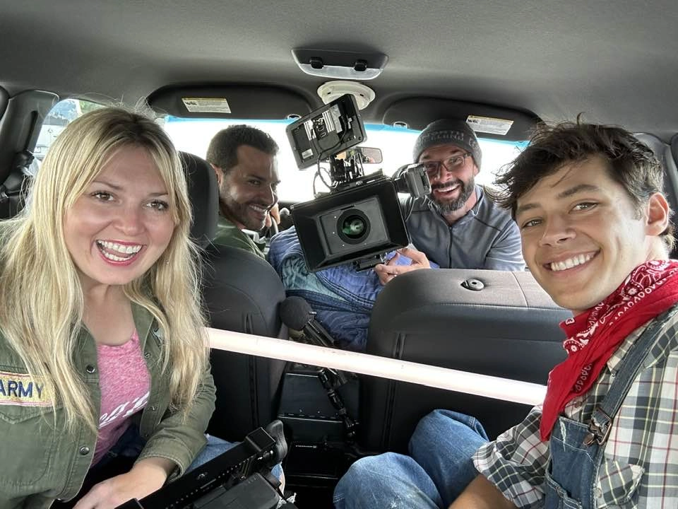 Filmmaker Savannah Ostler and actor Matt Cornett in the back of a van while shooting the film Buster Brooks.