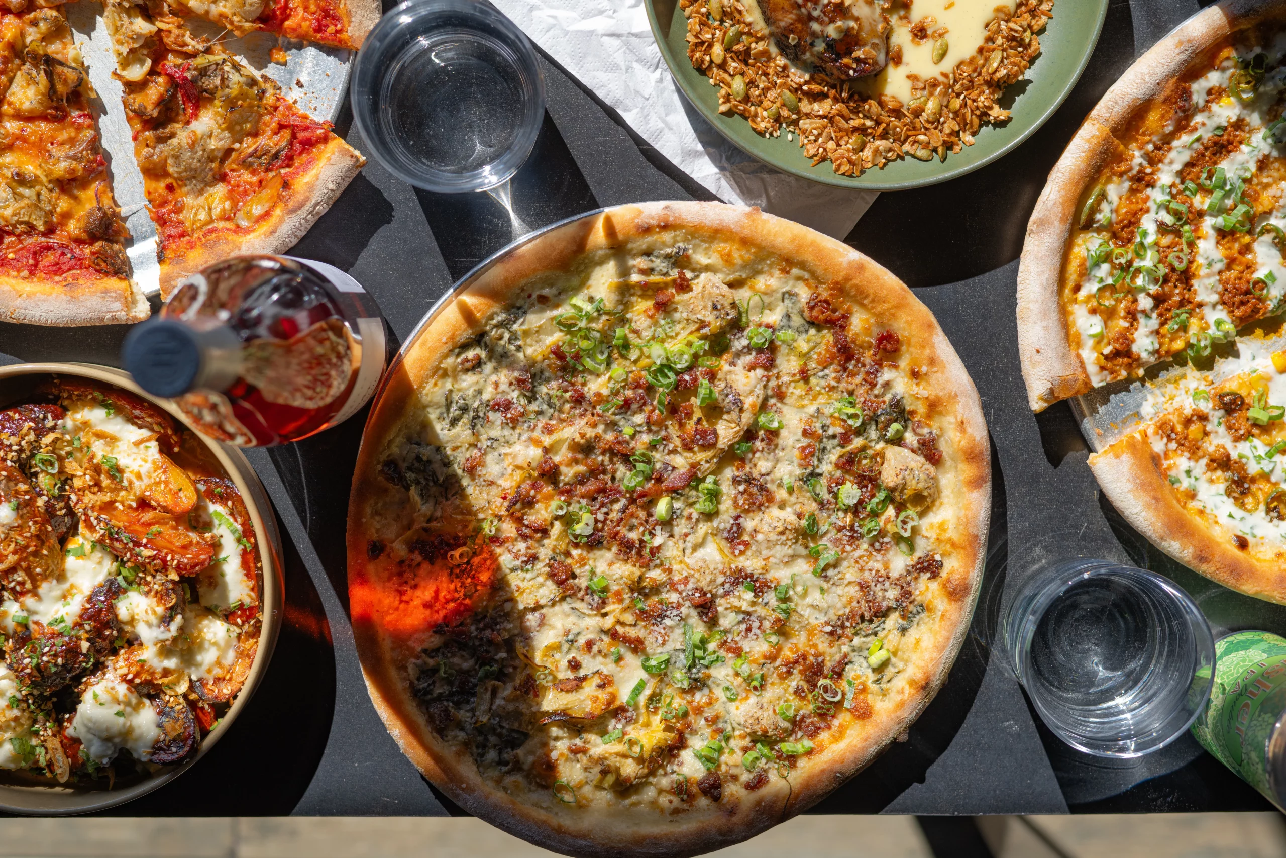 An assortment of pizza pies offered at Nomad East.