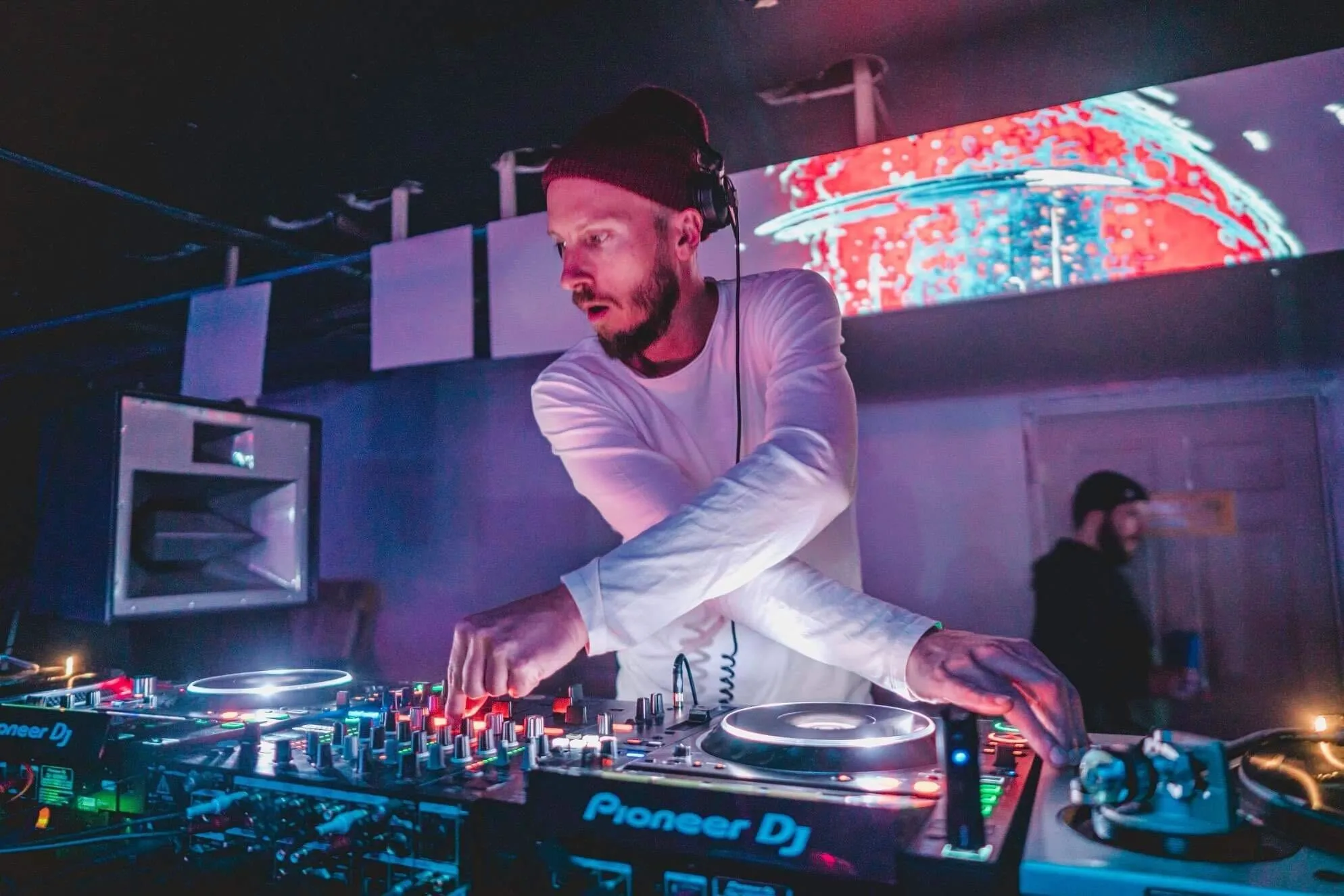 Salt Lake City-based DJ Matthew Fit seen chopping it up on-stage behind the decks.