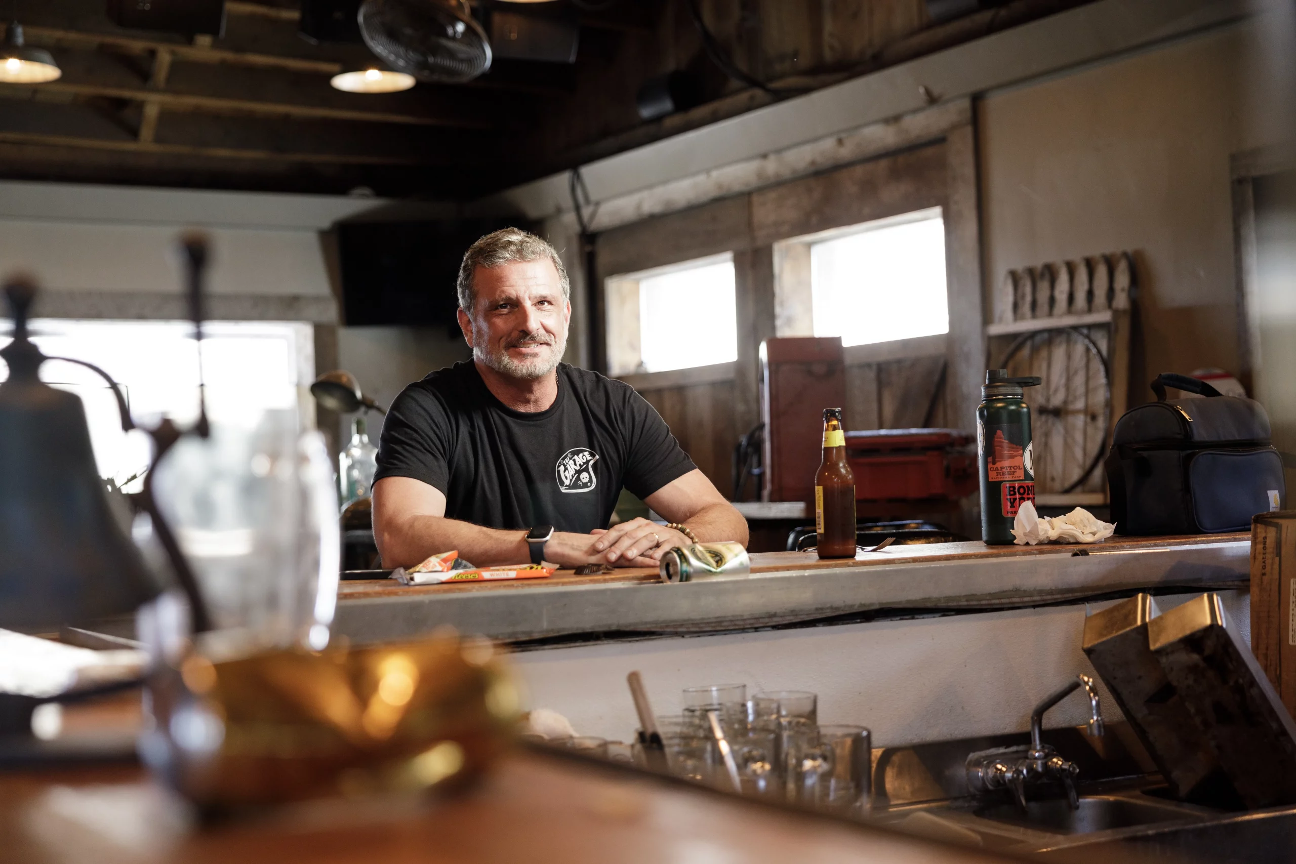 Bob McCarthy sits at a bar top.
