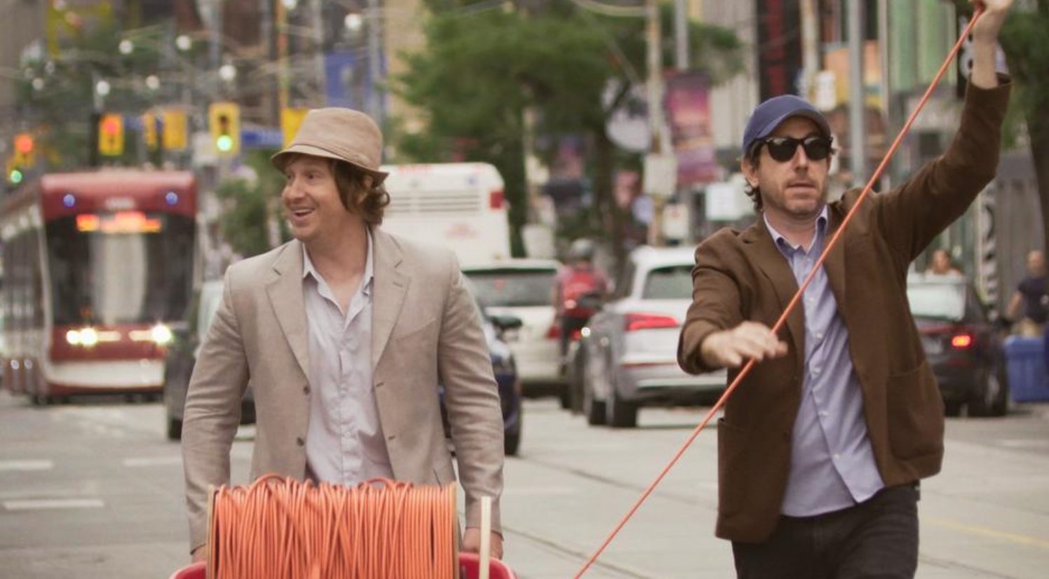 Matt Johnson and Jay McCarrol walk down the street in Nirvanna the Band the Show the Movie