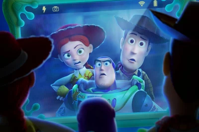A scene from Toy Story 5. A tablet captures an image of three toys looking confused and startled.